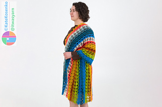 Side view of crochet shawl draped over one shoulder and belted at waist, showing soft stripes and drape