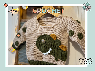 beige crochet sweater with moss green cuff, featuring a moss green dinosaur applique, mustard and moss green spikes run down the spine of the dinosaur. the dinosaur has white teeth and googly eye. the sleeves of the jumper has crochet spots sewn to them. dinotastic crochet sweater pattern for babies and toddlers by jane burns
