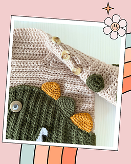 beige crochet sweater with moss green cuff, featuring a moss green dinosaur applique, mustard and moss green spikes run down the spine of the dinosaur. the dinosaur has white teeth and googly eye. the sleeves of the jumper has crochet spots sewn to them. dinotastic crochet sweater pattern for babies and toddlers by jane burns