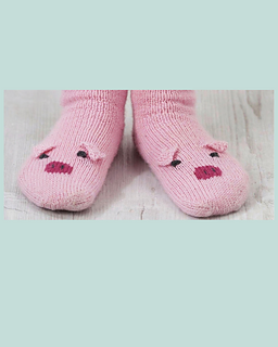 Front view of kids pig socks in pink 4ply yarn, each toe with a Swiss darned snout and embroidered eyes