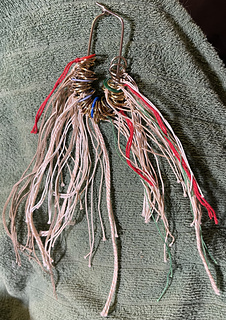 2024-02-16 48 stitch markers used to keep me on track - 6 coloured plastic ones between each repeat; 7 metal rings between each ten stitches.