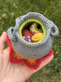 Mini ingredients inside of the witch's cauldron.