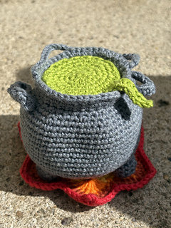 Witch's Cauldron with mixture lid on - mini ingredients are hidden inside.