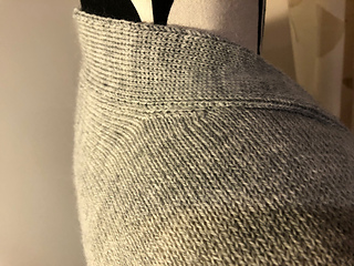 Neckband attached at back neck