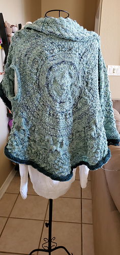 Sweater with right sleeve finished.