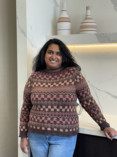 I am wearing a size 5, knit with 0" of ease and tapered sleeves