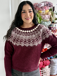 Shreya is wearing a size 4 sweater