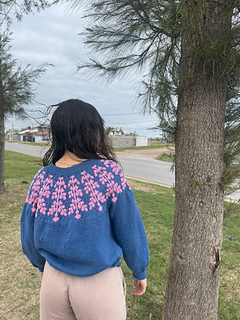 Andrea is wearing a size 5 sweater. This is an oversized fit