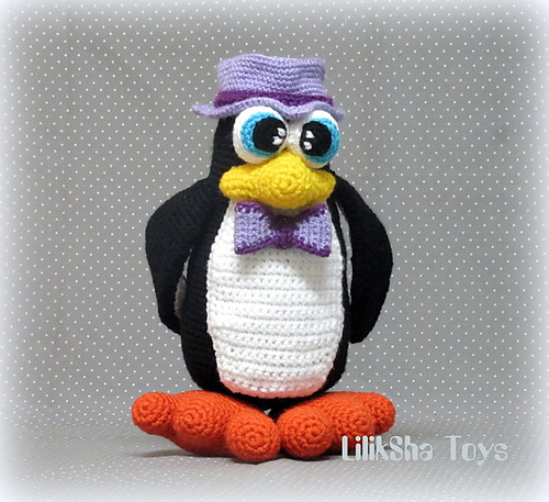 Penguin wearing a hat and a bow tie. photo 1