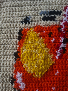 Close up of the details. This pattern includes instructions to add embroidered embellishments to your tapestry