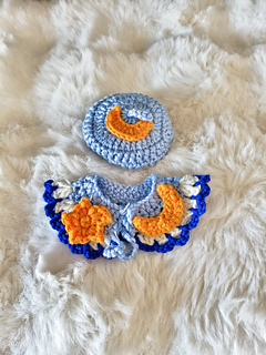 Cape with star and moon decorations — close-up