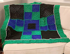 A cozy burst of color and comfort - the Granny Squares Throw, ready to brighten any space.