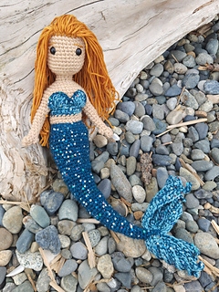 Yarn held double to achieve larger size. One strand of Stranded Studio Mermaid sequin yarn for tail and fins. 