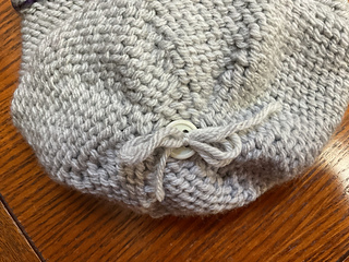 Pom Pom made removable by using button.