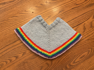 Body of poncho is same yarn/color as the hat.