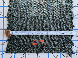 Gauge swatch with two needle sizes: 4.5mm bottom, 5.5mm top.