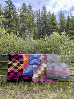 From left to right: large tapestry blanket, small intarsia blanket, dish towel, large intarsia blanket, small tapestry blanket