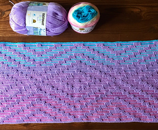 Small size blanket after Row 34 in Lion Brand Mandala yarn in Liger as Yarn B and Bernat Baby Sport in Lavender as Yarn A.