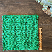 This free crochet pattern is made using single crochet and chain stitches with a simple one-row repeat. It works up fast, making it a great stashbuster and gift idea.