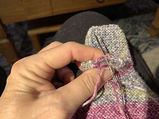 Shows how the heel stitches are folded for sewing that part