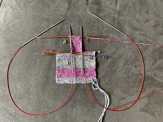 Circular needles were used to insert into the side stitches for the pick ups. I knit them off the circulars.