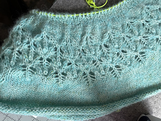 on the left, as knit.  On the right, lightly steamed and the bumps even out as well as the increases.