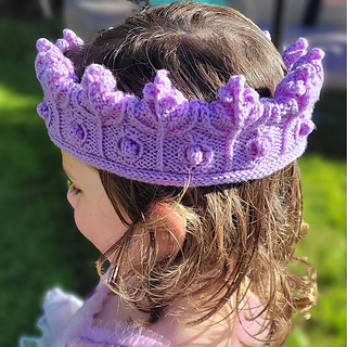 Texture comes from twisted stitches, cables and popcorn bobbles