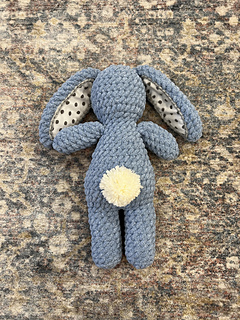 Bunny is complete with a pom pom tail (instructions included in pattern)