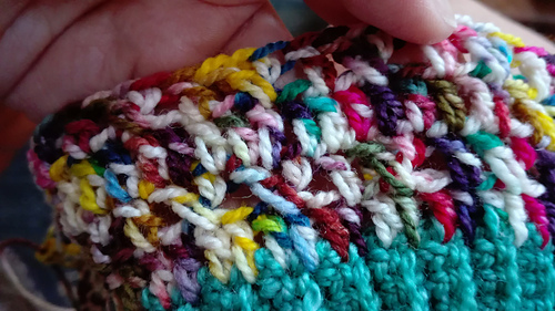 Shows the special crossed double (treble UK) stitch. And, with hindsight, my incorrect version of the cross stitch, with an extra missed stitch.
