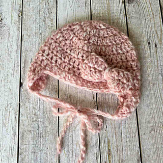 Easy baby hat with bow and ear flaps crochet pattern