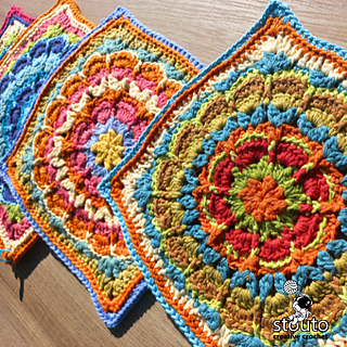 Fiorone granny square crochet pattern worked in smooth cotton yarn with textured flower centre