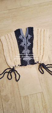 A beautiful crochet top featuring a delicate flower-inspired stitch. A perfect lightweight handmade for warm days.