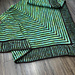 Sample is standard size made with Fingering weight yarn.