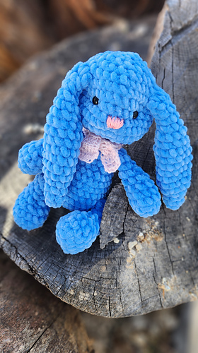  crocheted long-ear bunny, showing its soft texture and size