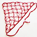 A beautifully crafted crochet triangle head scarf laid flat