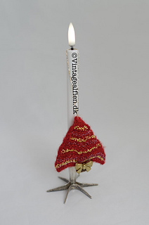 The knitted Xmas tree on an electric candle