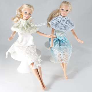 Two dolls enjoying a good time wearing their Susie cape