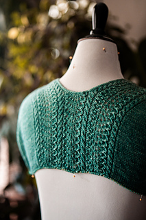 Stitches for the back shoulders are picked up from the cast-on and shaped with short rows for a smooth fit.