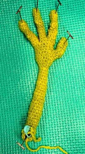 Wet blocking the hand shortly after completion to give better shape to the rather arthritic looking hands.