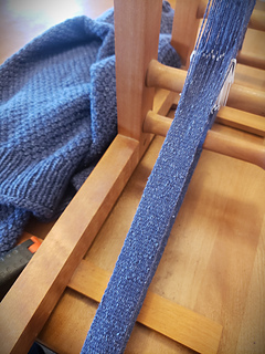 Inkle band, being woven in the same yarn, to cover the raw edges of the steek. 