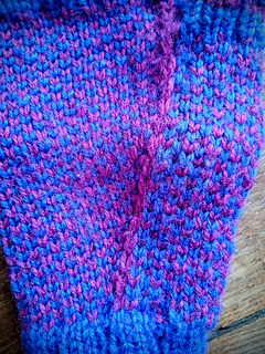 Pink (CC) held dominant on hand (left); Purple (MC) held dominant on thumb (right)