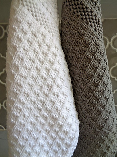 Multiple stitch patterns and variances in gauge are a design feature