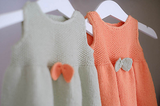 Knitted dress for baby. Image.
