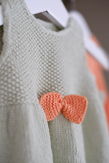Knitted dress for baby. Image.