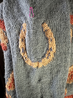 Finished sleeve colorwork, pre-blocking. 