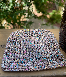 Sample of coaster in recommended yarn, in full view, without a cup on top.