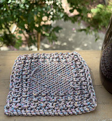 Sample in recommended yarn of the underside of the coaster, with the ends weaved in.