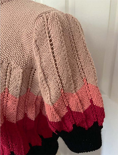 The pattern instructions have modified the original sleeve so that the chevron pattern is continued to the top.