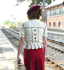 The peplum of the Flowers for Laura cardigan is a distinctive vintage and Tyrolean feature, designed to be worked into the main knitting or as a detachable addition.