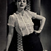 Anny Blatt ruffles crochet to create this demure blouse. For expert crocheters!